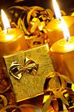 Gold christmas candles and gold gift boxes
