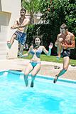 People jumping to swimming pool