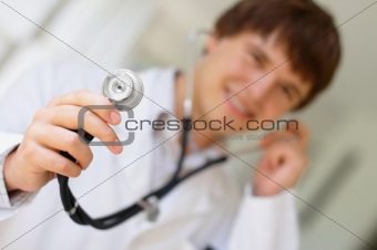 Young doctor holding a stethoscope