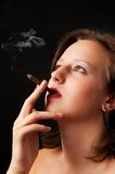 beautiful woman smokes a cigarette 