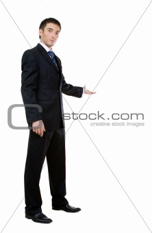 Businessman with arm out in a welcoming gesture 