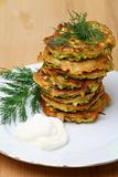 Zucchini fritters  with sour cream 