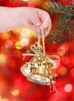 Golden Christmas tree decorations on lights background