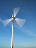 windy day with motion wind turbine.