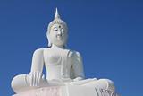 white buddha statue with blue sky.