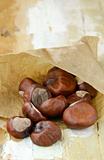 fresh chestnuts in brown paper bags