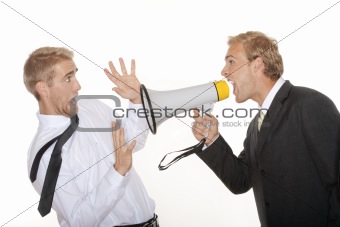 angry boss in suit yelling into a megaphone to scared employee - isolated on white