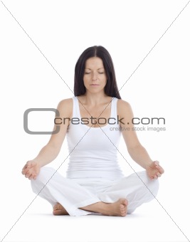woman sitting on the floor exercising yoga - isolated on white