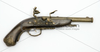 Ancient pistol isolated on a white background