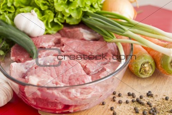 Beef meat on table and vegetables