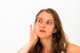 Relying on hand-ear listening young woman