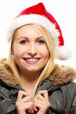 beautiful laughing blonde woman in a parka wearing santa's hat