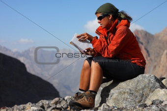Young woman resting in the mountains