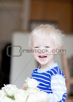 toddler with flower