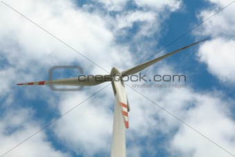 Wind turbine on blue sky