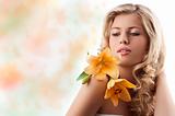 blond curly girl with orange flower