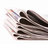 Pile of newspapers isolated over white background