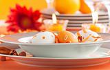 Easter table setting in orange tones