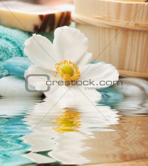 Spa setting with flower and blue candle