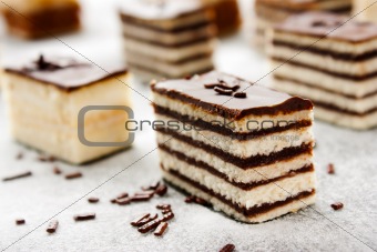 Various cake pieces of chocolate and vanilla filling.