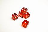 Detail of five red dice on white background