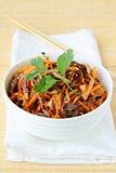 Asian style salad with carrots, meat and chili peppers
