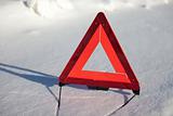 warning triangle on snow serface