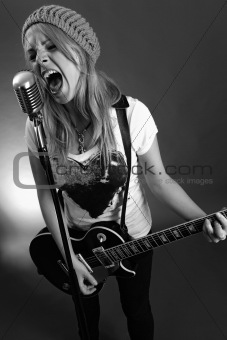 Guitarist screaming into old microphone