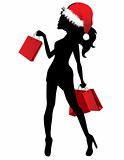 Silhouette of woman in Santa cap with bags
