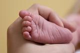 hand holding baby's foot