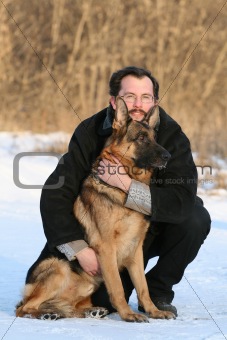 Man and dog sitting