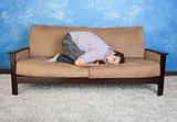 Frustrated Man On Sofa