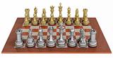 Metal chess set on wooden board