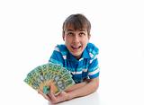 Boy with a fan of money banknotes