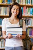 Portrait of a student holding books