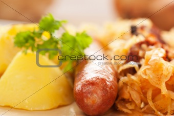 Sausage with potatoes and sauerkraut