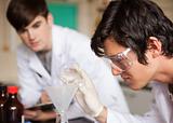 Close up of students in chemistry making an experiment