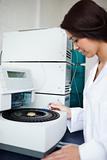 Laboratory assistant using a centrifuge