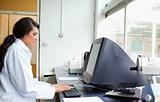 Female scientist using a monitor