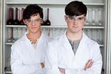 Serious male scientists posing