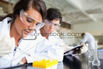 Two young scientists making an experiment