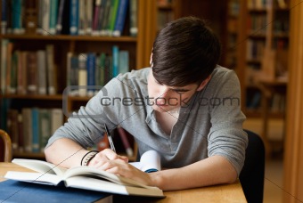 Focused male student working