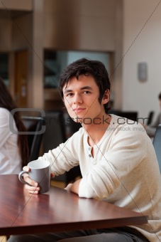 Portrait of a man having a coffee