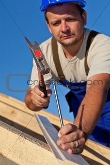 Carpenter working on the roof