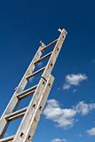 Dirty ladder pointing to the sky