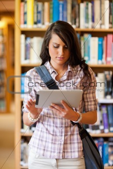 Portrait of a gorgeous student using a tablet computer