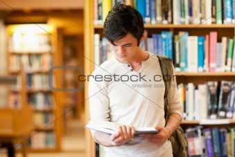 Serious student reading a book