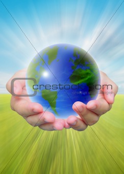 world and women hand holding on blue sky