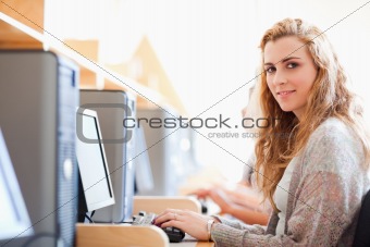 Student posing with a computer