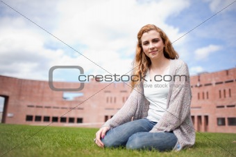 Young woman sitting on a lawn